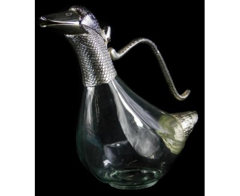 A duck shaped glass claret jug, with plated mounts, 23cm high.