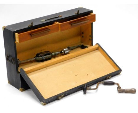 A stained wooden tool chest, the hinged lid enclosing a fitted interior with some tools, 74cm wide.