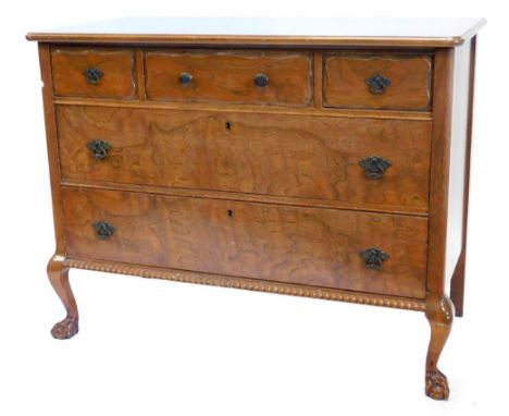 A continental walnut commode, the top with a moulded edge above three frieze drawers and two further long drawers, with a gad