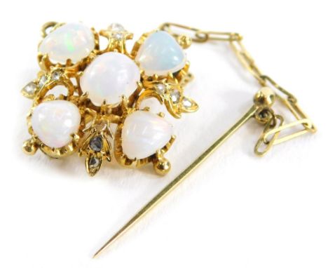 A Victorian opal and diamond brooch, with central over cut opal in claw setting, surrounded by four triangle cut opals and de