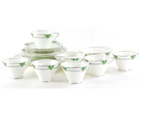 A Coalport porcelain Art Deco part tea service, each piece decorated in green and silver with triangular motifs, the handles 