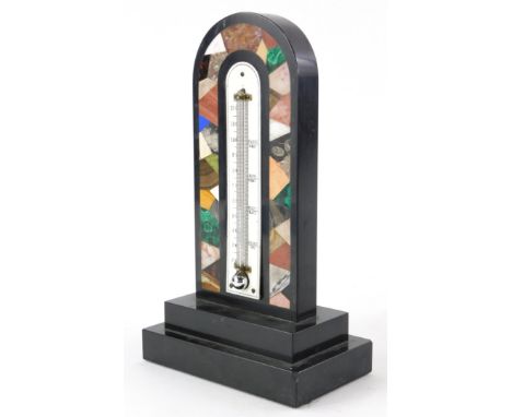 A 19thC black slate and specimen stone table thermometer, the arched top with a central mercury thermometer, surrounded by in