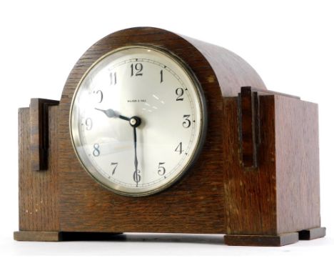 An Art Deco mantel clock, the silvered dial stamped Walker and Hall, 30cm wide.