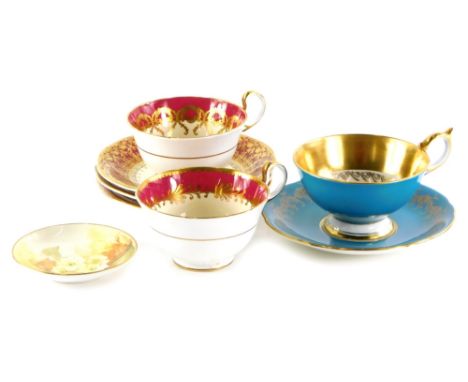 A part Harlequin set of Aynsley cups and saucers, differing designs and colours, to include three cups, four saucers and a Ro