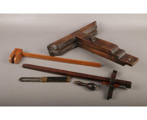 A small collection of vintage tools and measures.  