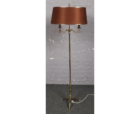A decorative brass twin branch standard lamp.  
