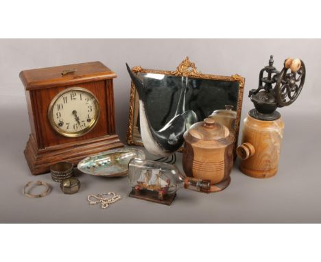 A group of collectables, to include oak mantle clock, gilt frame mirror, silver napkin ring, turned wooden tobacco jar etc.  