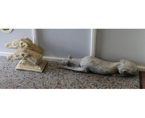 A cast garden statue formed as a recumbent greyhound and another the portrait bust of two hounds.  