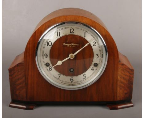 A Garrard 8 day Westminster and Whittington mantel clock in walnut case and housing a movement with platform escapement.  Sol