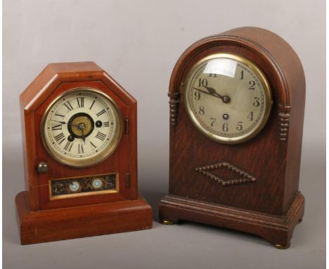 An early 20th century American postman's alarm clock by Seth Thomas, striking on a bell. Along with an oak case 8 day mantel 