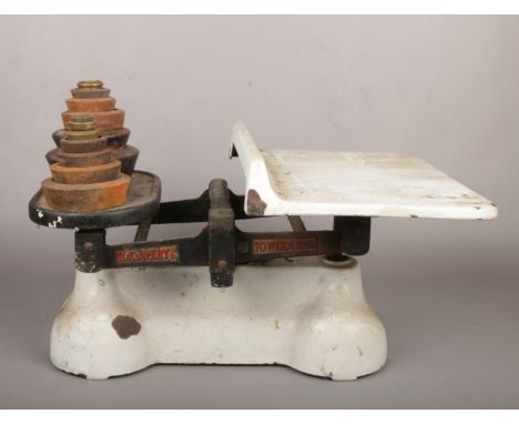 A set of enamelled Avery scales and weights.  