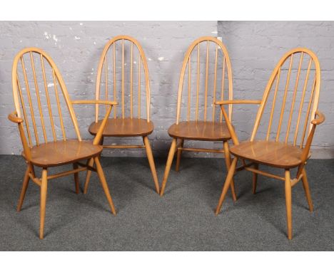 A set of four Ercol light elm spindle back dining chairs, including two carvers.  