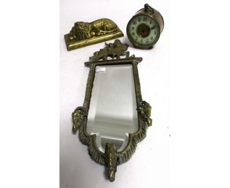 A 19th Century brass mirror with Satyrs heads,  surmounted by a centaur and pipe player, with bevelled glass, height 41cm, to