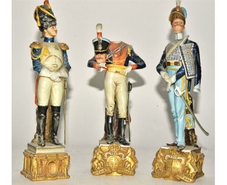 Three Capodimonte porcelain Continental soldiers, raised on square plinth with eagles, height 29.5cm, one with the British mo