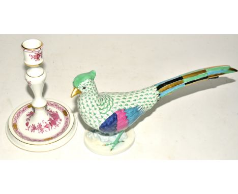 A Herend Hungarian porcelain pheasant,  in the green colourway, with plume of gold, blue and black, raised on an oval base, 1