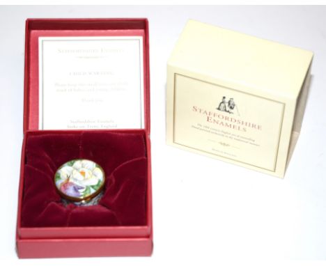 A modern Staffordshire enamel pill pot,  with flower and hummingbird decoration, in original box, 3cm 