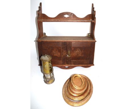A contemporary brass miner's lamp,  together with an early 20th Century oak wall cupboard, and with a collection of oval comp