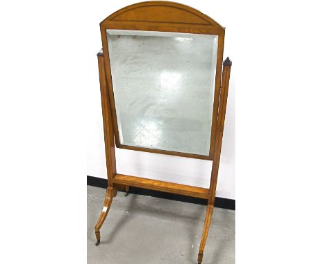 A Sheraton revival satinwood cheval mirror, bevelled plate in arch top frame with herringbone banding, rectangular columns, s