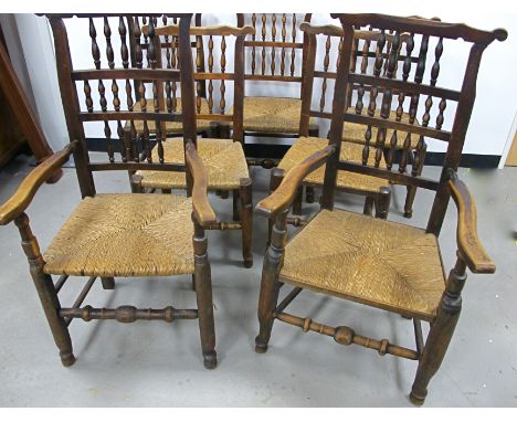 A set of seven late 19th Century north country beech and elm ladder back chairs,  including five sides and two carvers, with 
