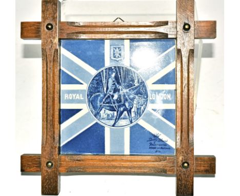 A Delft pottery blue and white tile,  for the 1953 coronation of Queen Elizabeth II, framed, internal dimensions 16cm x 15cm 