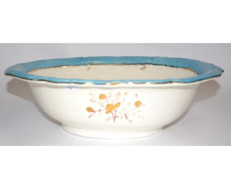A ceramic wash bowl with transfer print of birds and turquoise border,  measuring 48cm x 37cm x 12cm 