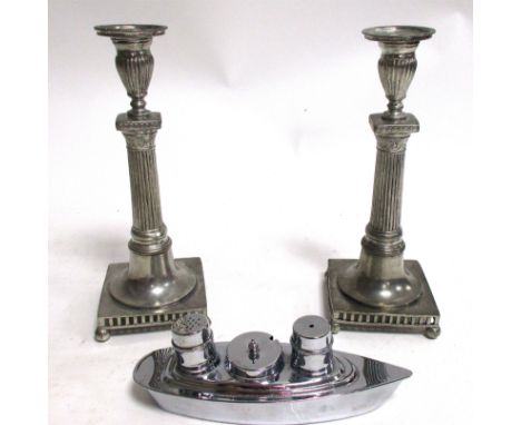 A pair of Munka Swedish candlestick holders,  of Corinthian form, raised upon four feet, height 26cm, together with a 20th Ce