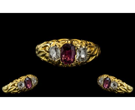 Antique Period Attractive 18ct Gold Ruby and Diamond Set Ring, in an excellent scroll design setting, c1850s, the ruby and di