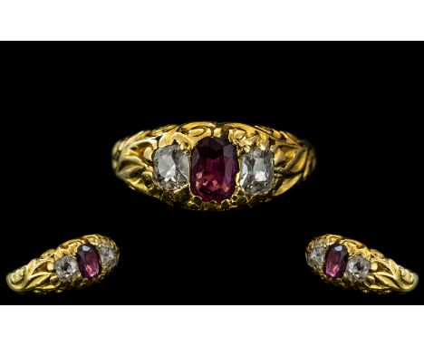 Antique Period Attractive 18ct Gold Ruby and Diamond Set Ring, in an excellent scroll design setting, c1850s, the ruby and di