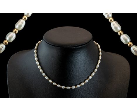 Ladies - Attractive and Nice Quality Pearl Necklace Set with 9ct Gold Spacers and Clasp. Marked for 9.375. Excellent Conditio
