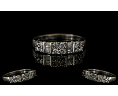 Ladies 14ct White Gold Brilliant and Baguette Cut Diamond Set Dress Ring. The Brilliant Cut and Baguette Cut Diamond of White