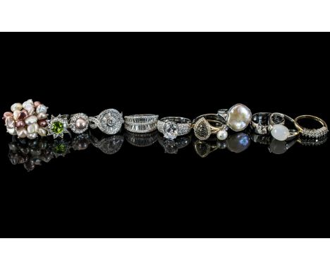Collection of Twelve Silver Dress Rings, set with pearls and crystals, comprising a stone set ring with crystal shoulders, a 