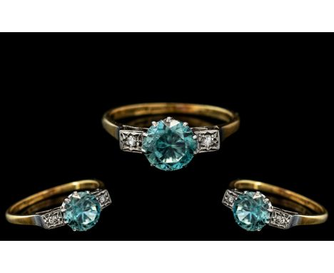 18ct Gold and Platinum Diamond and Zircon Set 3 Stone Ring. The Central Blue Zircon of Deep Sea Colour with Diamond to Either