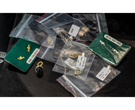 Small Collection of 9ct Gold Jewellery, comprising a green and crystal set pendant, a pair of blue stone set earrings for pie