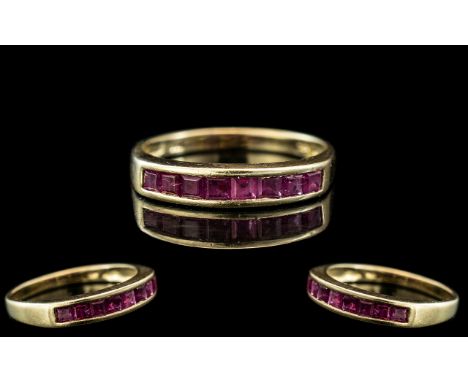 14ct Yellow Gold - Attractive Ruby Set Ring. The Eight Princes Cut Rubies of Good Colour. Ring Size M. Marked 14ct to Interio