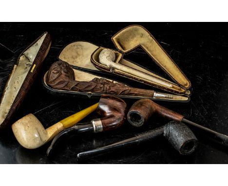 A Collection of Smoking Pipes to include a cased carved pipe with recumbent lion and floral bowl in fitted case. Together wit