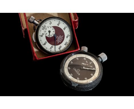 Two Omega Stop Watches one marked Omega Prestons Timer Division Bolton, in original box. The other is stamped Omega with blac