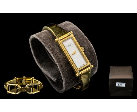 Ladies Gucci Bracelet Watch, No.1500L, pearl face with gold hands, gold tone bracelet.