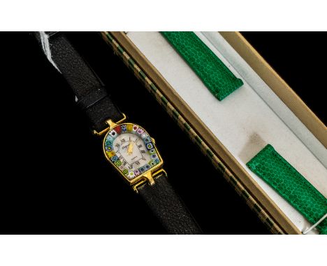 A Ladies Murano Wristwatch with Millefiori bezel and changeable green leather italian strap. Complete with box and informatio