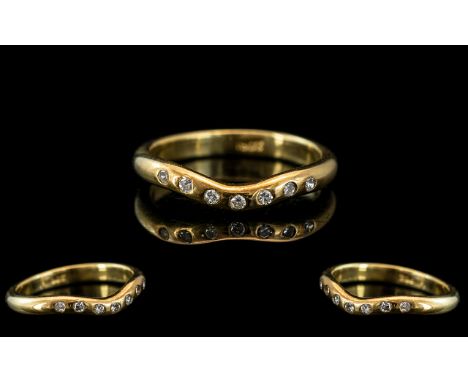 An 18ct Gold Diamond Ring Set with Seven Round Brilliant Cut Diamonds. Ring Size O. Weight 4 grams.