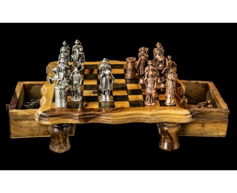 A Small Size Wood Chess Set with gold coloured historic figures as chess pieces.