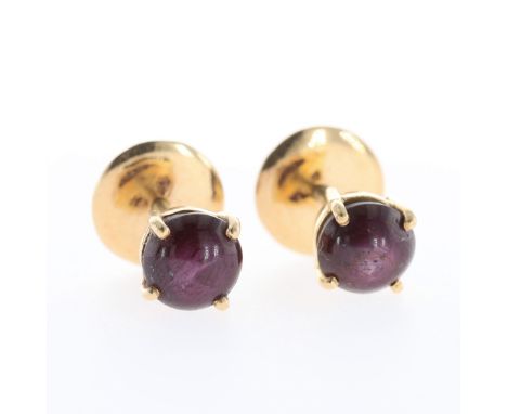 Pair of gold Star Ruby stud earring with screw backs. Measures approx. 7mm in diameter. These have been tested to 18ct gold. 