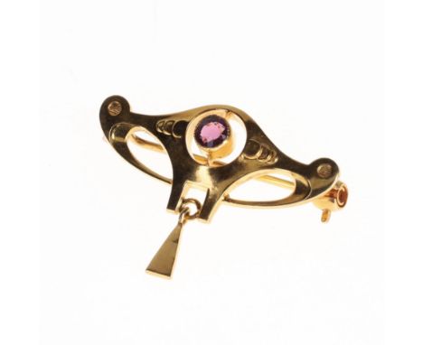 9ct gold Arts and Crafts brooch set with Amethyst. Measures approx. 2.7 x 1.8cm. Stamped 9ct on the reverse. Clasp is in work