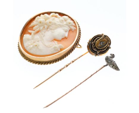 Collection of antique low carat gold brooch and stick pins inc. old cut Diamond, cameo. Cameo brooch measures approx. 4.4 x 3
