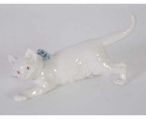 MEISSEN WHITE GLAZED PORCELAIN MODEL OF A CAT CRAWLING, with blue collar and ribbon, modelled by Otto Jarl, 7" (17.8cm) long,