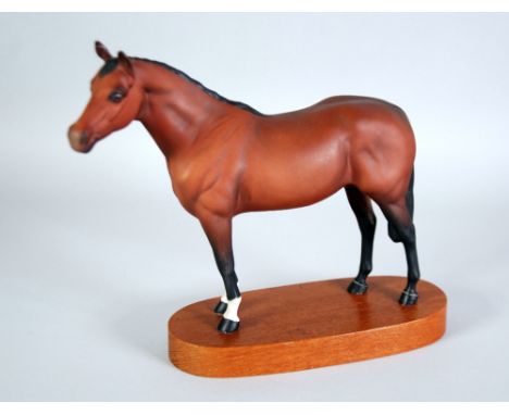 BESWICK 'THOROUGHBRED' BROWN BISQUE MODEL OF A RACE HORSE, on wooden stand, 9" (22.9cm) high, printed mark (one ear re-glued)