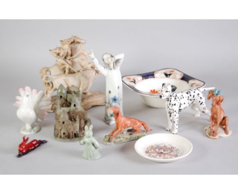 A ROYAL DOULTON FLAMBE MODEL RABBIT, A ROYAL DOULTON MODEL DALMATION, a German bisque model of a FIGURE ON HORSEBACK spearing