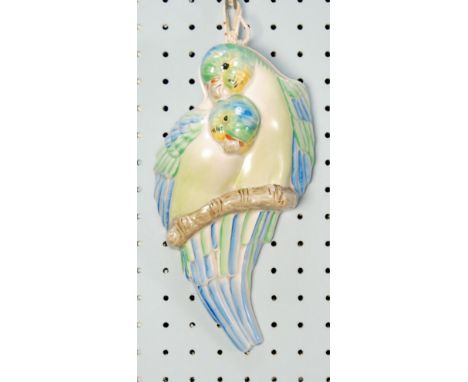 CLARICE CLIFF/NEWPORT POTTERY MOULDED POTTERY WALL POCKET, painted in colours and modelled as two budgerigars perched on a br