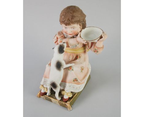 EARLY TWENTIETH CENTURY TINTED BISQUE GROUP, modelled as a young girl with a puppy, 12" (30.5cm) high 