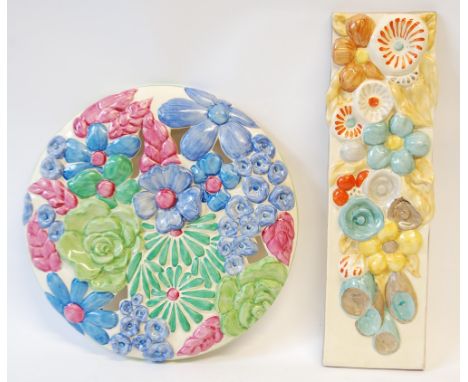 A CLARICE  CLIFF BIZARRE (NEWPORT POTTERY) CIRCULAR SHALLOW DOMED WALL PLAQUE, pierced and moulded with flowers picked out in