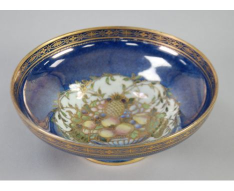 EARLY 20th CENTURY ROYAL WORCESTER 'CROWN WARE' CHINA BOWL, of shallow, footed form, gilt printed and painted with a basket o